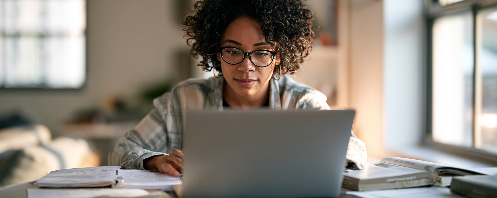Woman with glasses on laptop